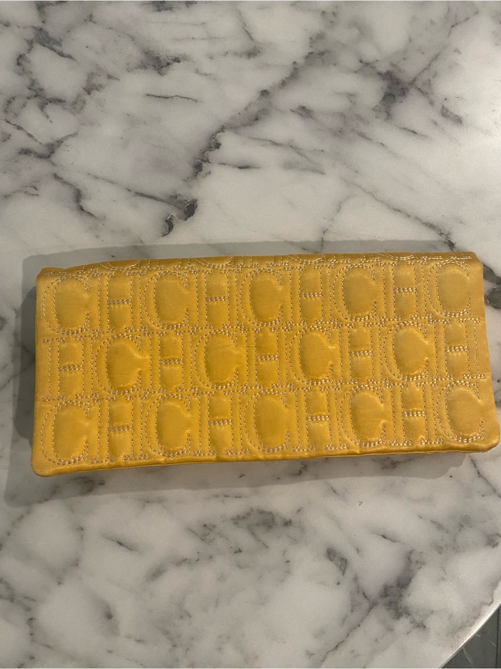 Carolina Herrera Quilted CH Logo Clutch in Mustard Gold